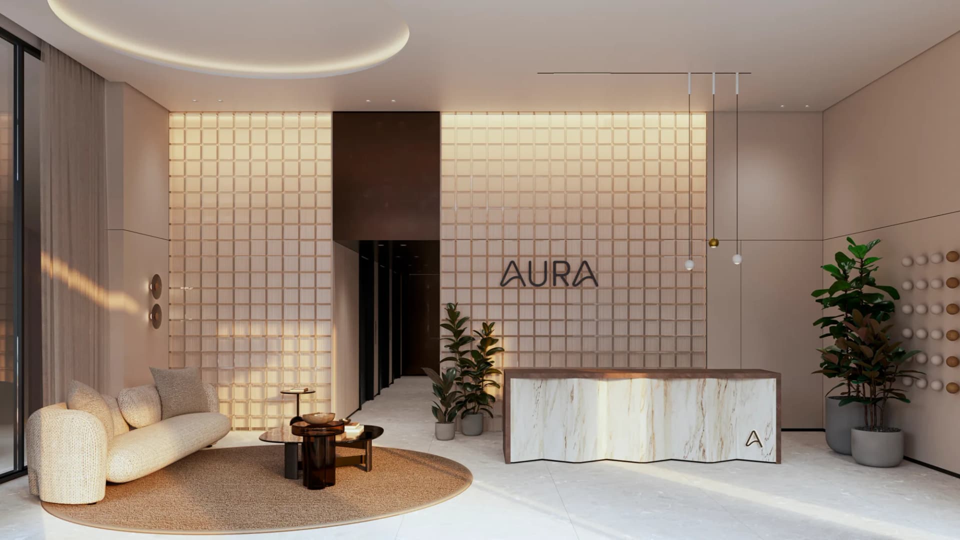 Lobby de AURA con recepción de mármol